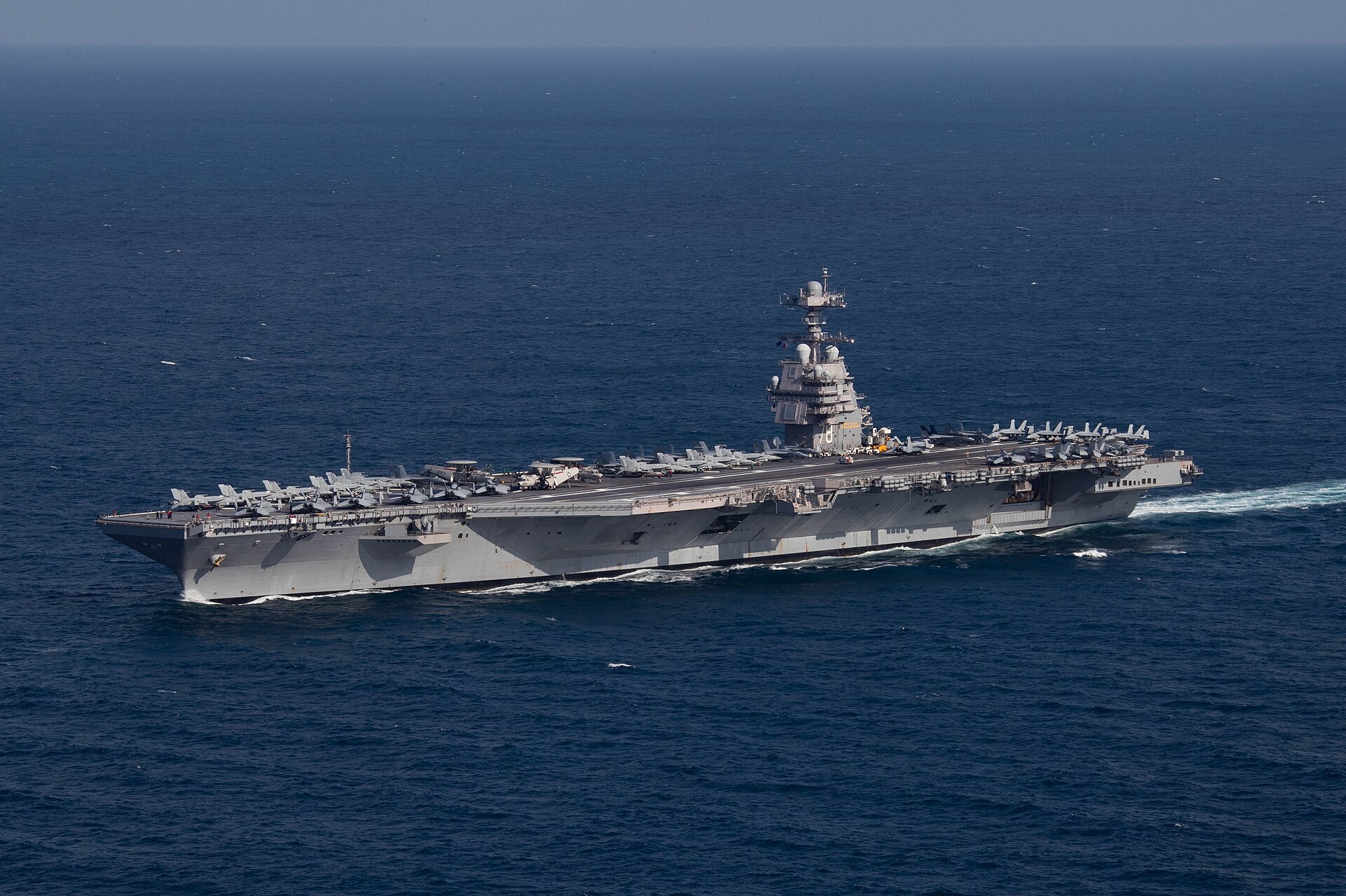 221009-N-TL968-1248 ATLANTIC OCEAN (Oct. 9, 2022) The first-in-class aircraft carrier USS Gerald R. Ford (CVN 78) steams the Atlantic Ocean during a simulated straits transit with the Gerald R. Ford Carrier Strike Group (GRFCSG) in the Atlantic Ocean, Oct. 9, 2022. The Gerald R. Ford Carrier Strike Group is deployed in the Atlantic Ocean, conducting training and operations alongside NATO Allies and partners to enhance integration for future operations and demonstrate the U.S. Navy's commitment to a peaceful, stable and conflict-free Atlantic region. (U.S. Navy photo by Mass Communication Specialist 2nd Class Jackson Adkins)
