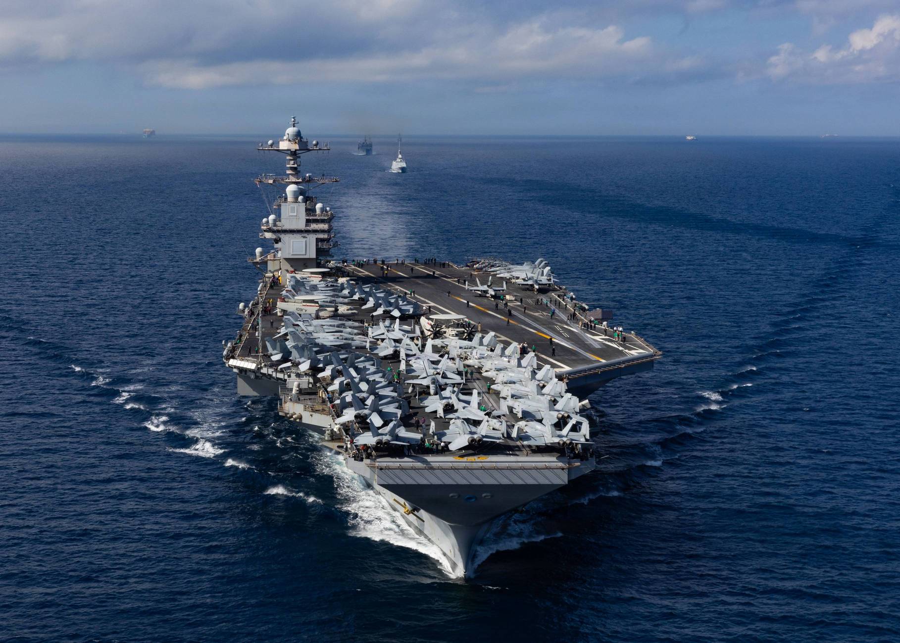 From front to back, the world’s largest aircraft carrier, USS Gerald R. Ford (CVN 78), Royal Moroccan Navy FREMM multipurpose frigate Mohammed VI (701), and Military Sealift Command fast combat support ship USNS Supply (T-AOE 6), steam in formation while transiting the Strait of Gibraltar, Oct. 1, 2025. Gerald R. Ford, a first-in-class aircraft carrier and deployed flagship of Carrier Strike Group Twelve, is on a scheduled deployment in the U.S. 6th Fleet area of operations to support the warfighting effectiveness, lethality and readiness of U.S. Naval Forces Europe-Africa, and defend U.S., Allied and partner interests in the region. (U.S. Navy photo by Mass Communication Specialist Seaman Apprentice Alyssa Joy)