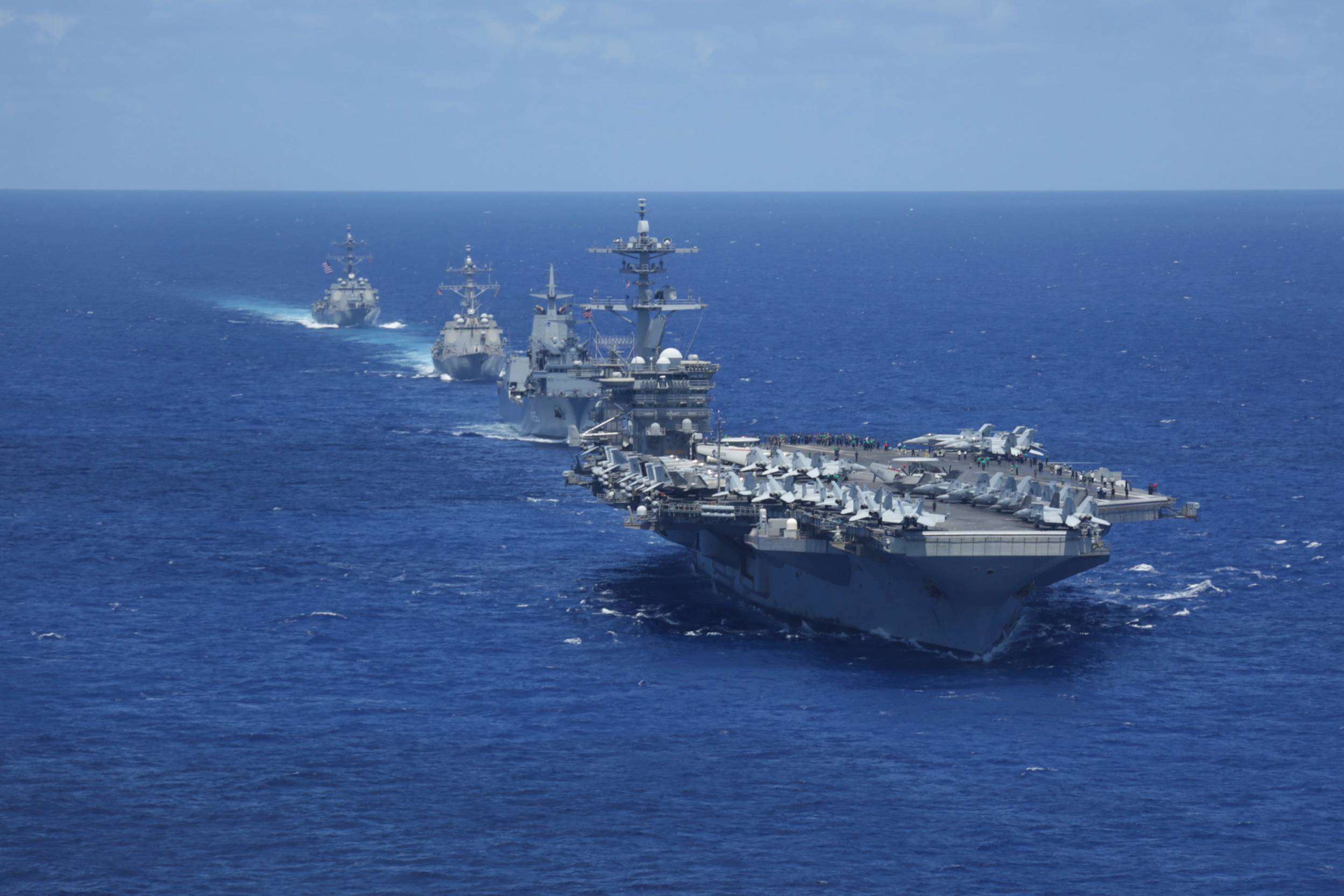 220623-N-DF558-1791 PACIFIC OCEAN (June 23, 2022) Nimitz-class aircraft carrier USS Abraham Lincoln (CVN 72), Royal Australian Navy auxiliary oiler replenishment ship HMAS Supply (AO 195), Arleigh Burke-class guided-missile destroyer USS Gridley (DDG 101) and Arleigh Burke-class guided-missile destroyer USS Spruance (DDG 111) sail in formation with Abraham Lincoln Carrier Strike Group (ABECSG), Japan Maritime Self-Defense Force and RAN ships. ABECSG is underway conducting routine operations in the U.S. 3rd Fleet. An integral part of U.S. Pacific Fleet, U.S. 3rd Fleet leads naval forces in the Indo-Pacific and provides the realistic, relevant training necessary to flawlessly execute our Navy’s role across the full spectrum of military operations—from combat operations to humanitarian assistance and disaster relief. U.S. 3rd Fleet works together with our allies and partners to advance freedom of navigation, the rule of law, and other principles that underpin security for the Indo-Pacific region.(U.S. Navy photo by Mass Communication Specialist Seaman Aleksandr Freutel)