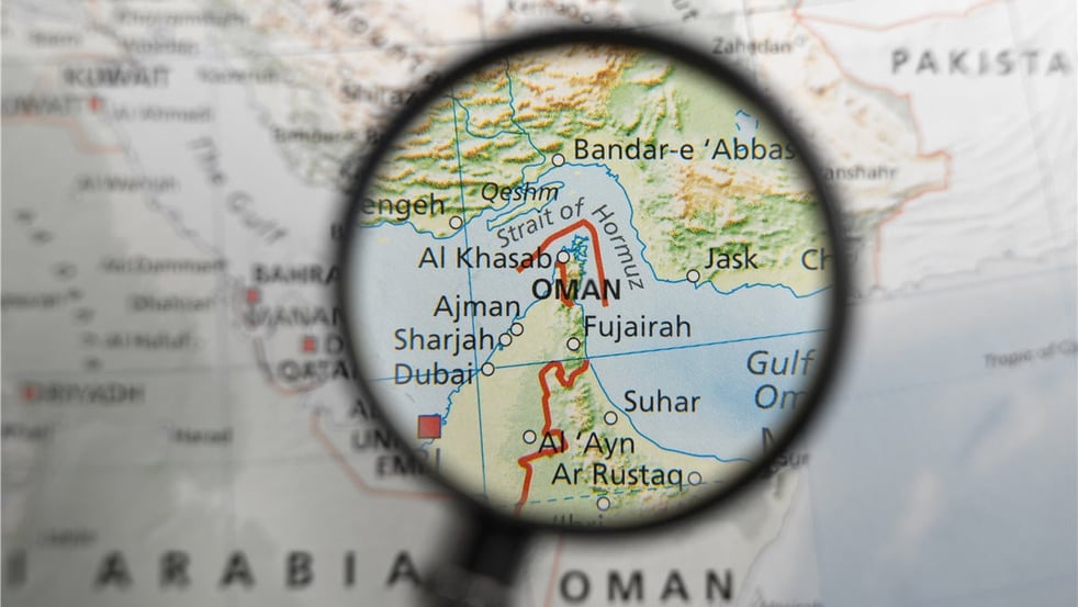 map-of-strait-of-hormuz-and-surrounding-area-under-magnifying-glass-illustration.jpg